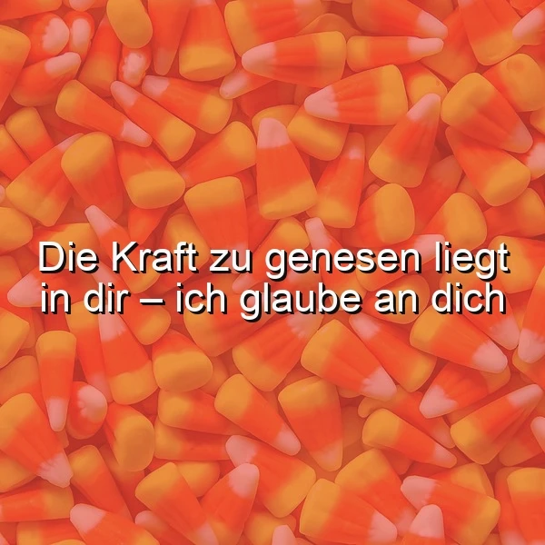Ein Haufen bunter Süßigkeiten, auf denen der Spruch 'Die Kraft zu genesen liegt in dir - ich glaube an dich' steht
